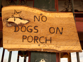 No dogs on porch sign.